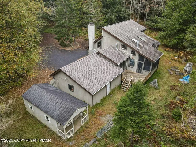 a view of a hallway with windows and stairs