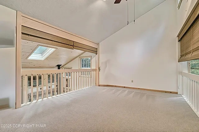 a bedroom with a bed a lamp and a window