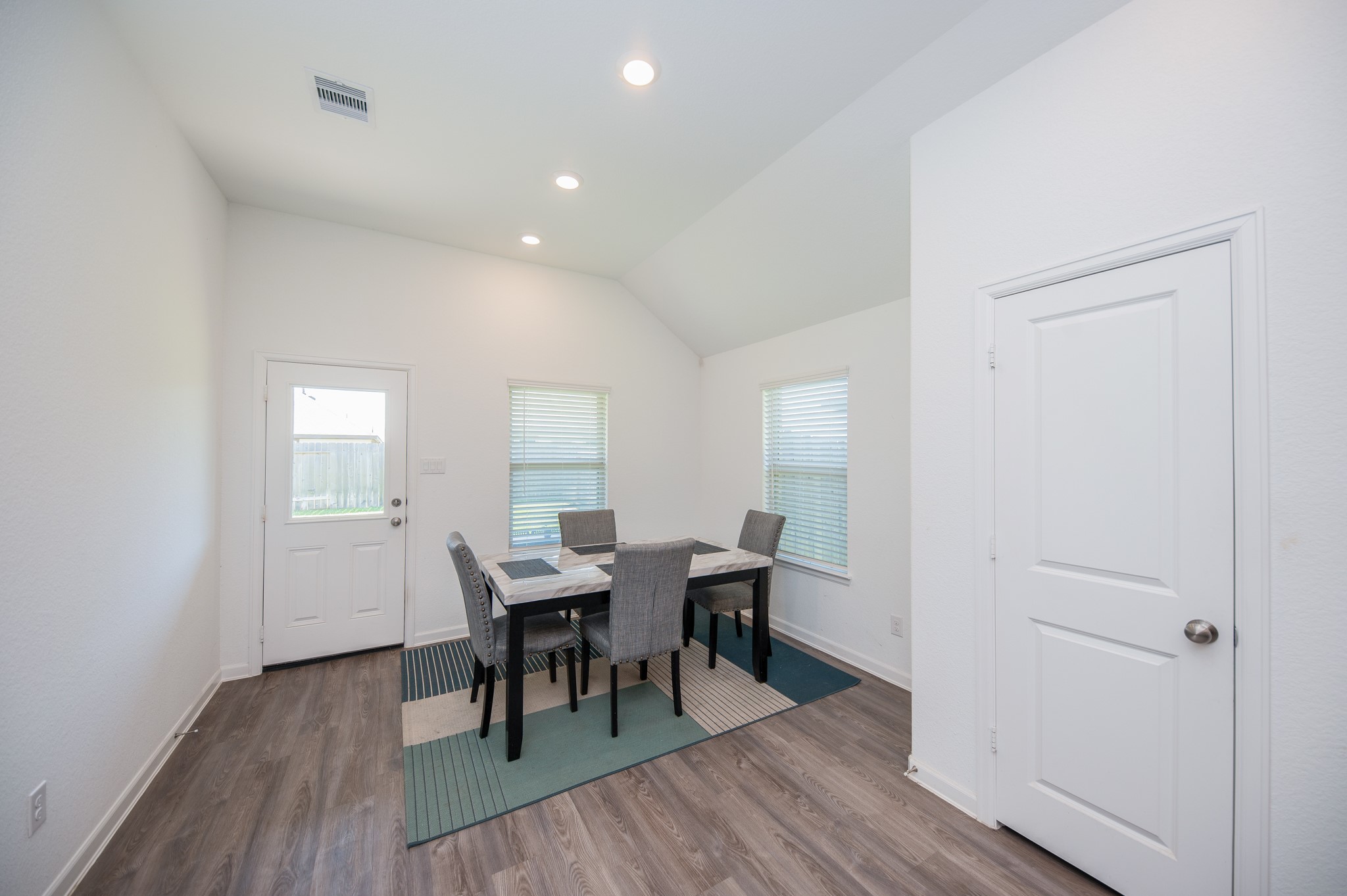 3634 Homestead Ridge Lane Richmond, TX 77406 - Photo 12 of 32 a view of a dining room with furniture and wooden floor