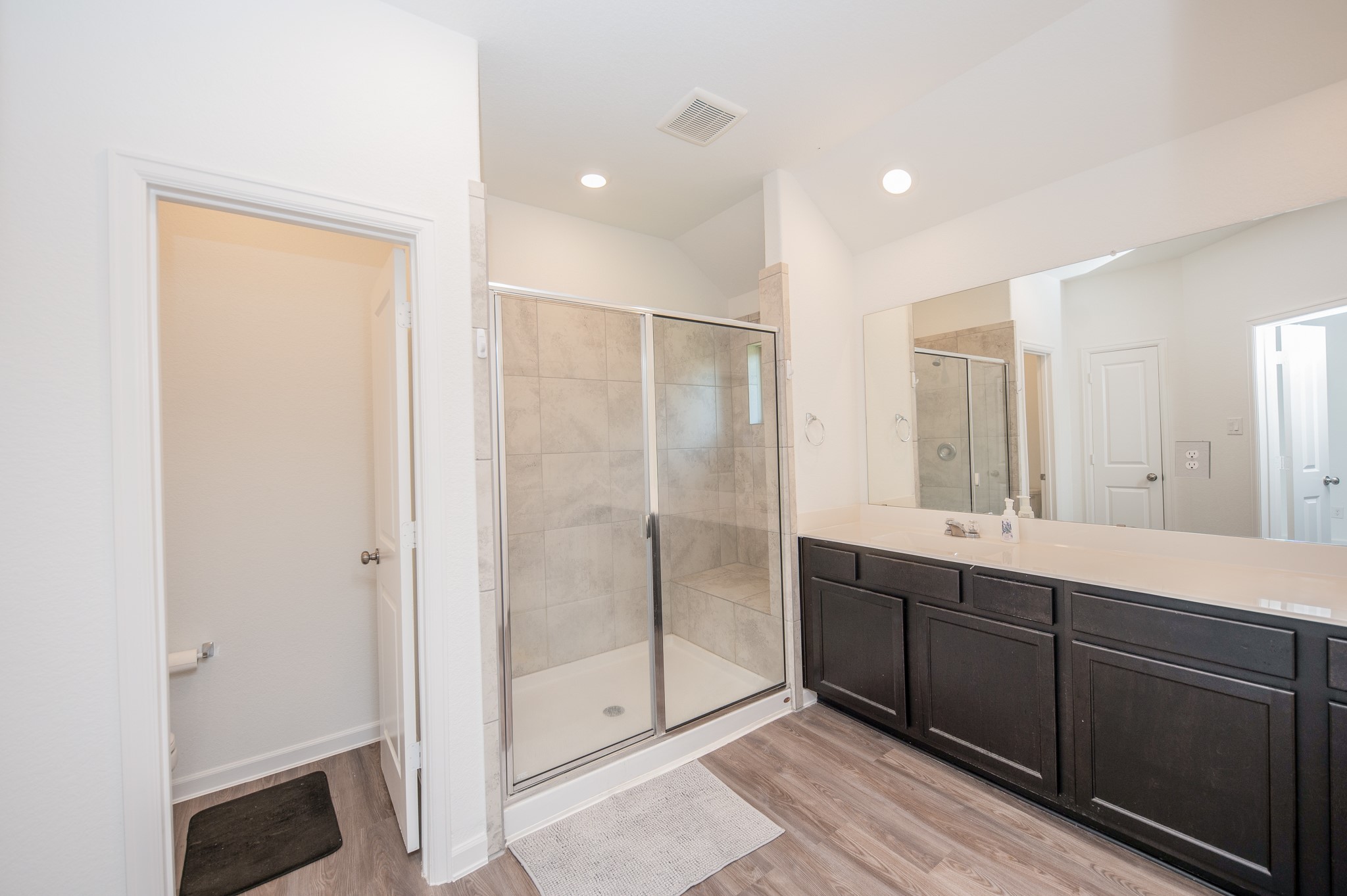 3634 Homestead Ridge Lane Richmond, TX 77406 - Photo 15 of 32 a bathroom with a double vanity sink and mirror
