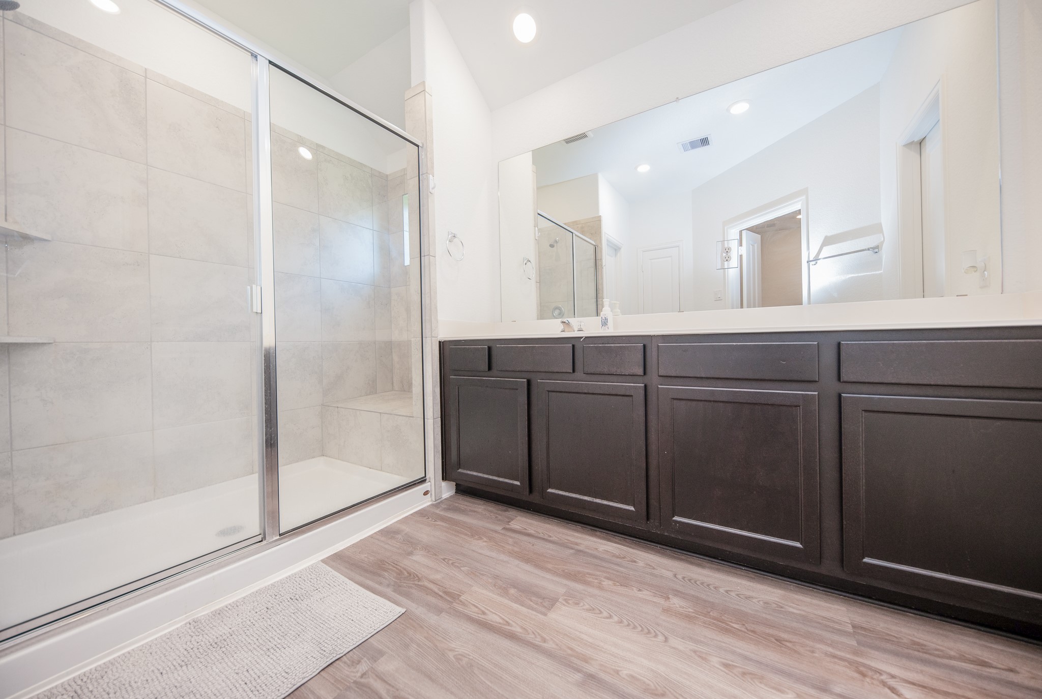 3634 Homestead Ridge Lane Richmond, TX 77406 - Photo 16 of 32 a spacious bathroom with a mirror and a shower