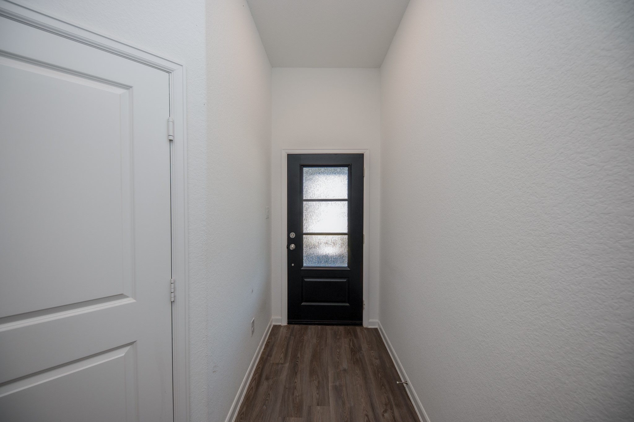 3634 Homestead Ridge Lane Richmond, TX 77406 - Photo 3 of 32 a view of a hallway with wooden floor and closet