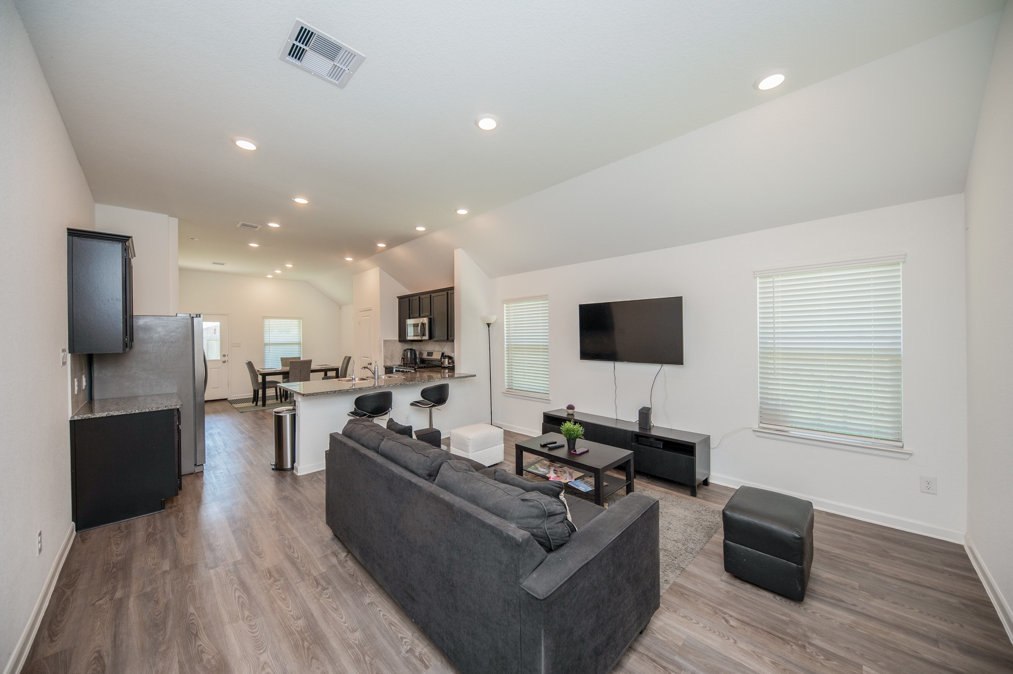 3634 Homestead Ridge Lane Richmond, TX 77406 - Photo 4 of 32 a living room with furniture and a flat screen tv