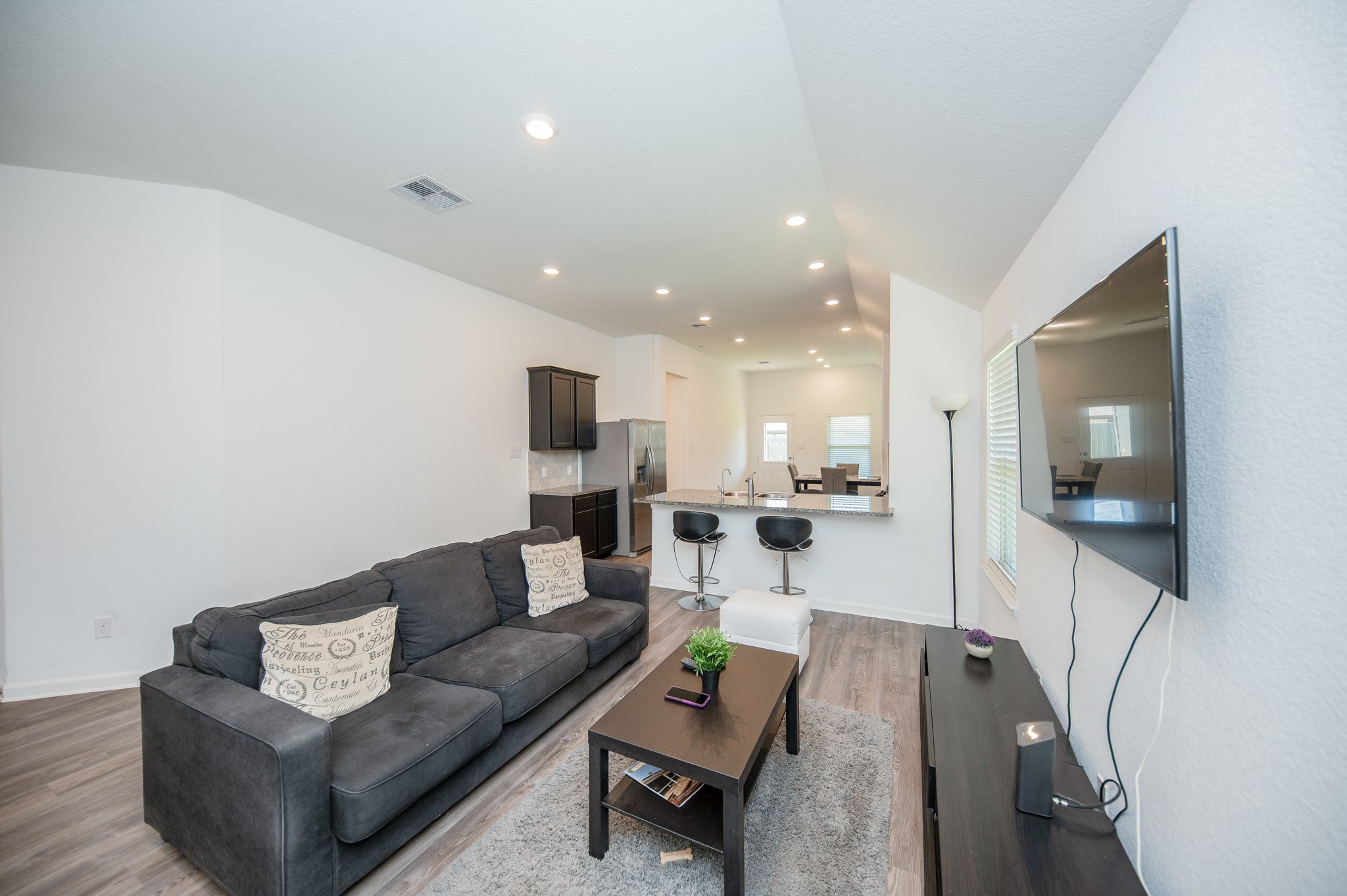 3634 Homestead Ridge Lane Richmond, TX 77406 - Photo 5 of 32 a living room with furniture and a flat screen tv