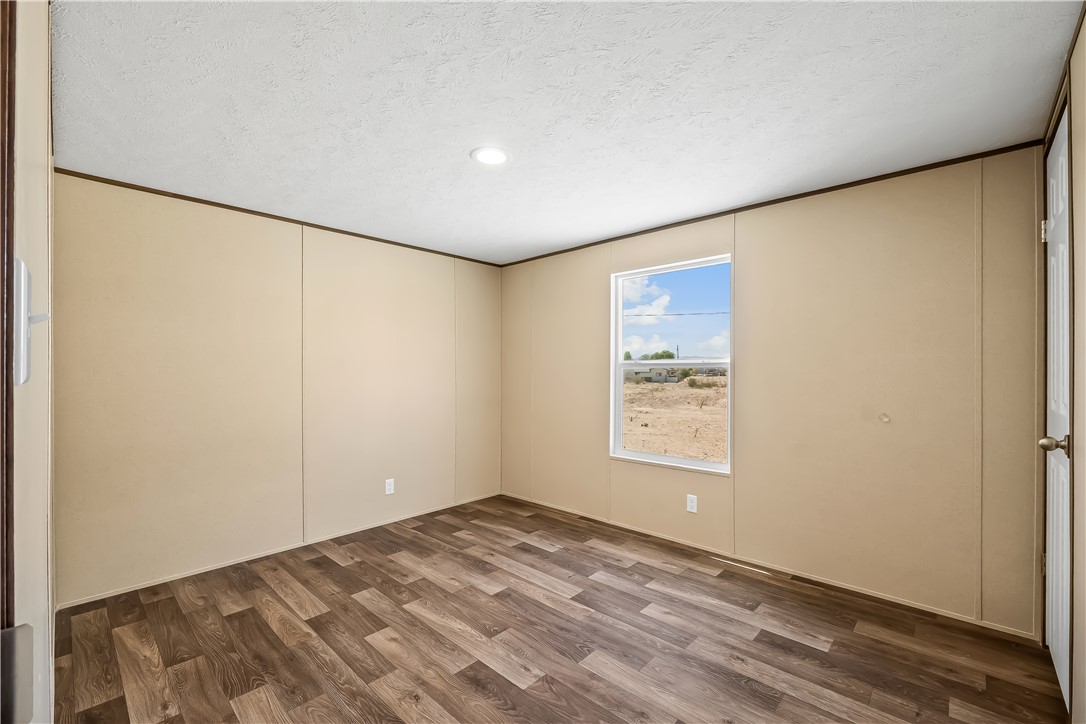 13205 South Water Reed Way Topock, AZ 86436 - Photo 31 of 37 a view of a big room with wooden floor and window