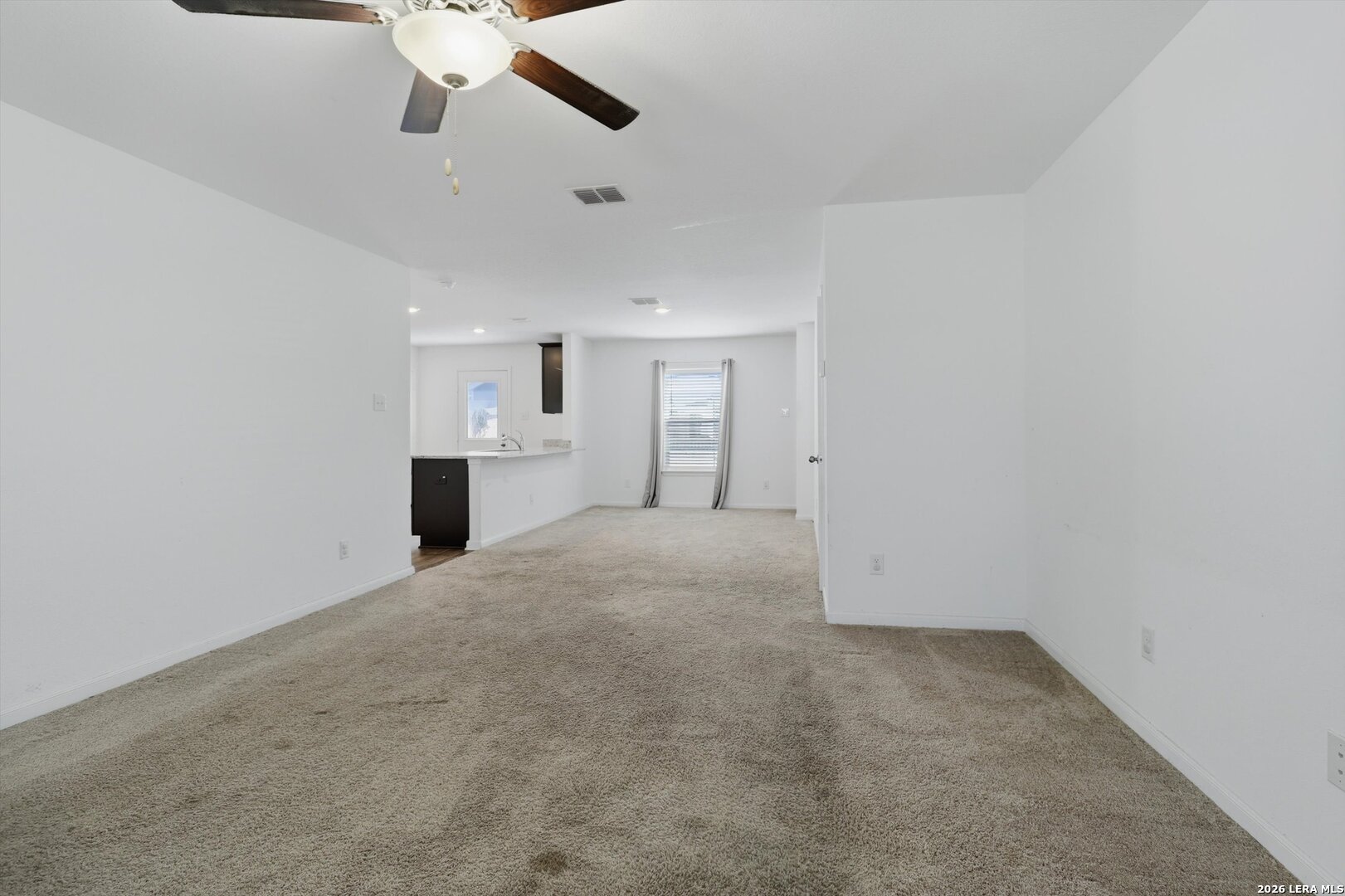 3130 Jackson Converse, TX 78109 - Photo 11 of 22 an empty room with a empty space and a ceiling fan