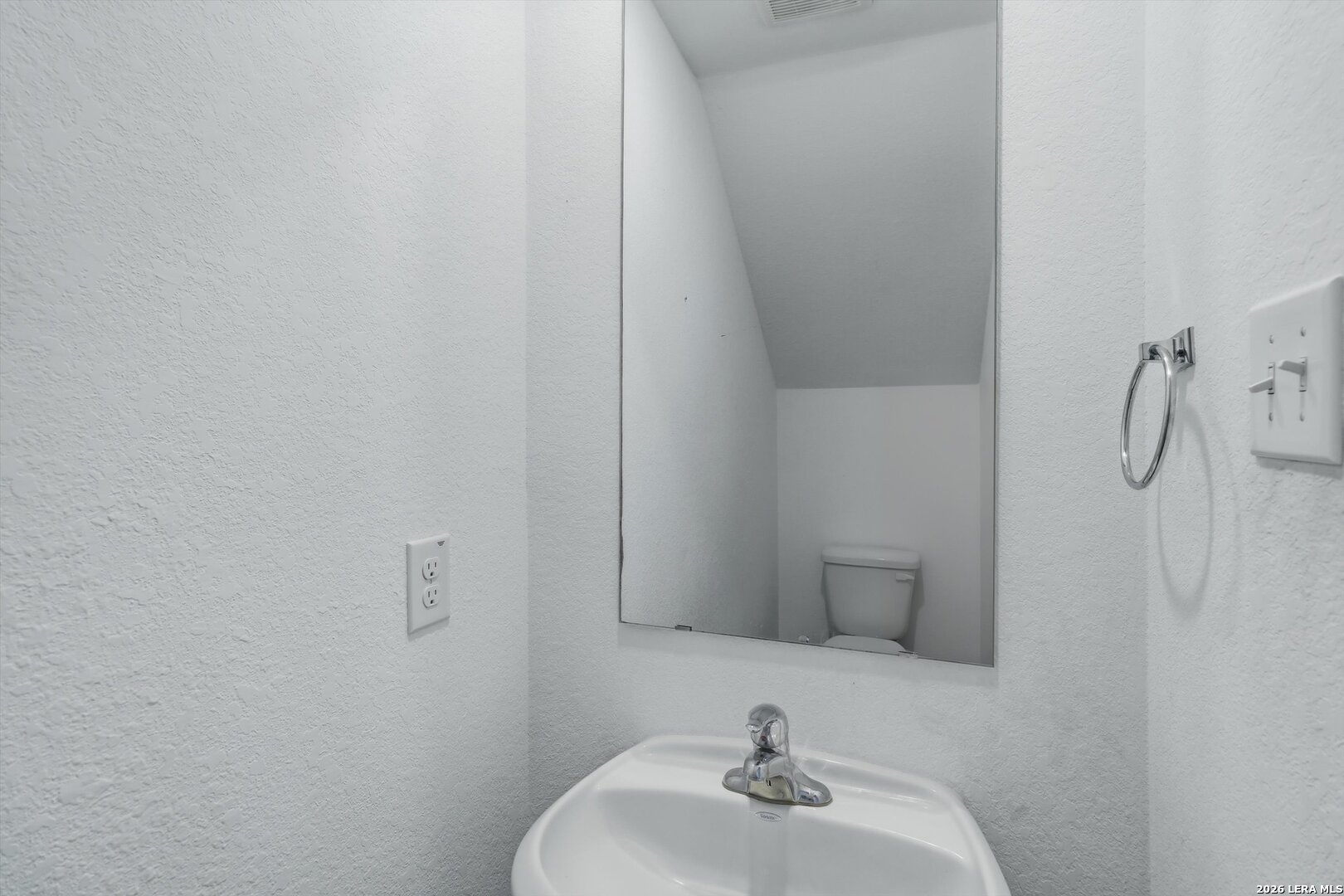 3130 Jackson Converse, TX 78109 - Photo 17 of 22 a bathroom with a sink and a mirror