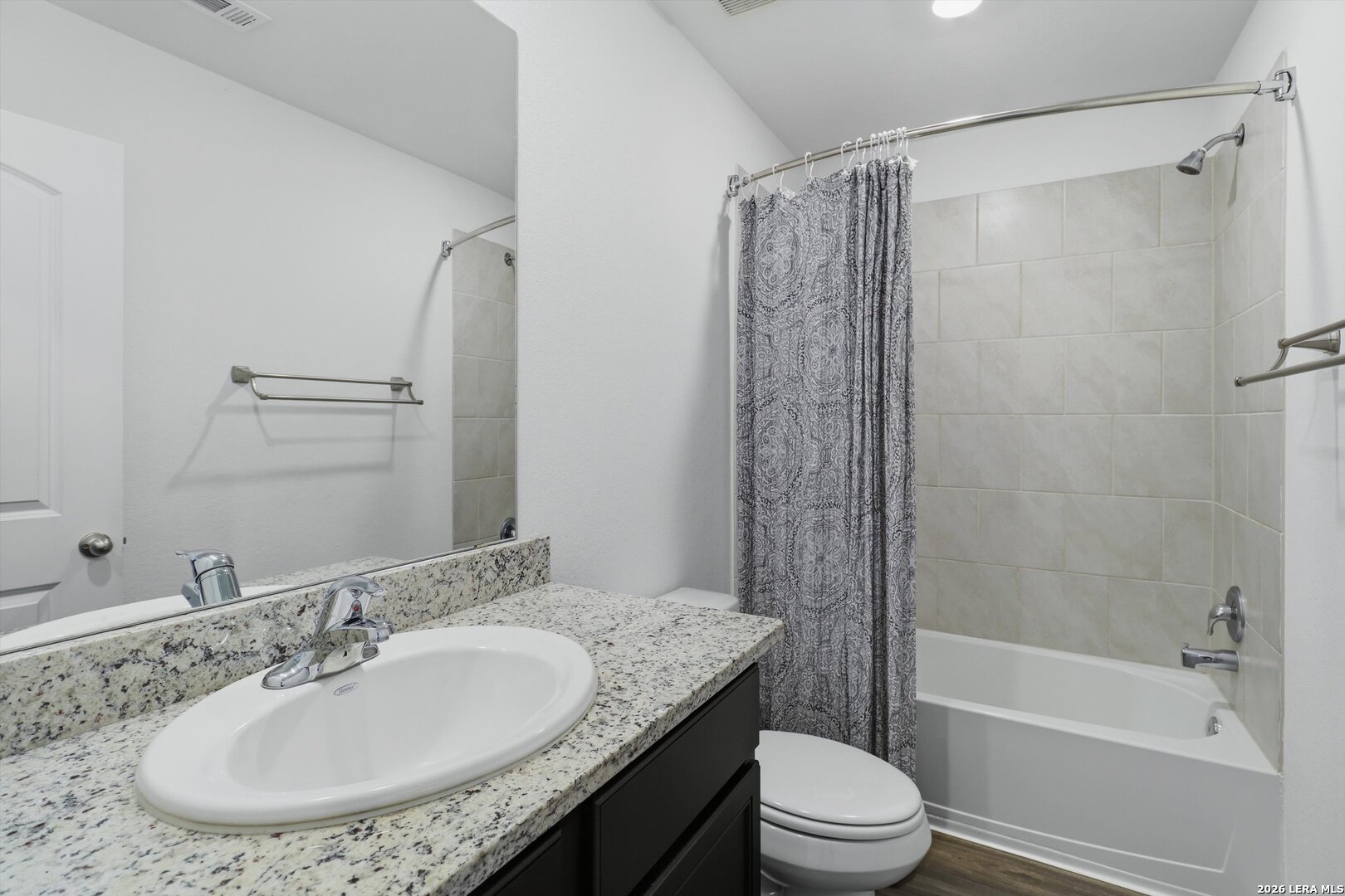 3130 Jackson Converse, TX 78109 - Photo 18 of 22 a bathroom with a granite countertop sink toilet and shower