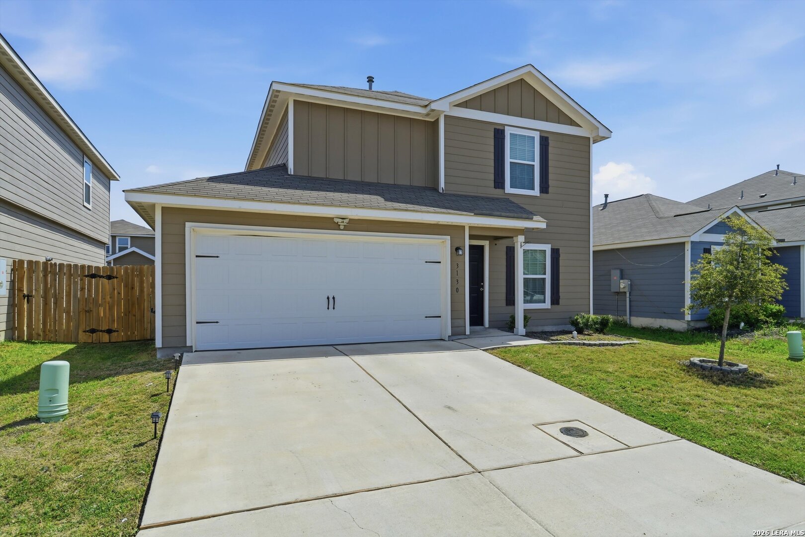 3130 Jackson Converse, TX 78109 - Photo 4 of 22 a front view of a house with a yard and garage