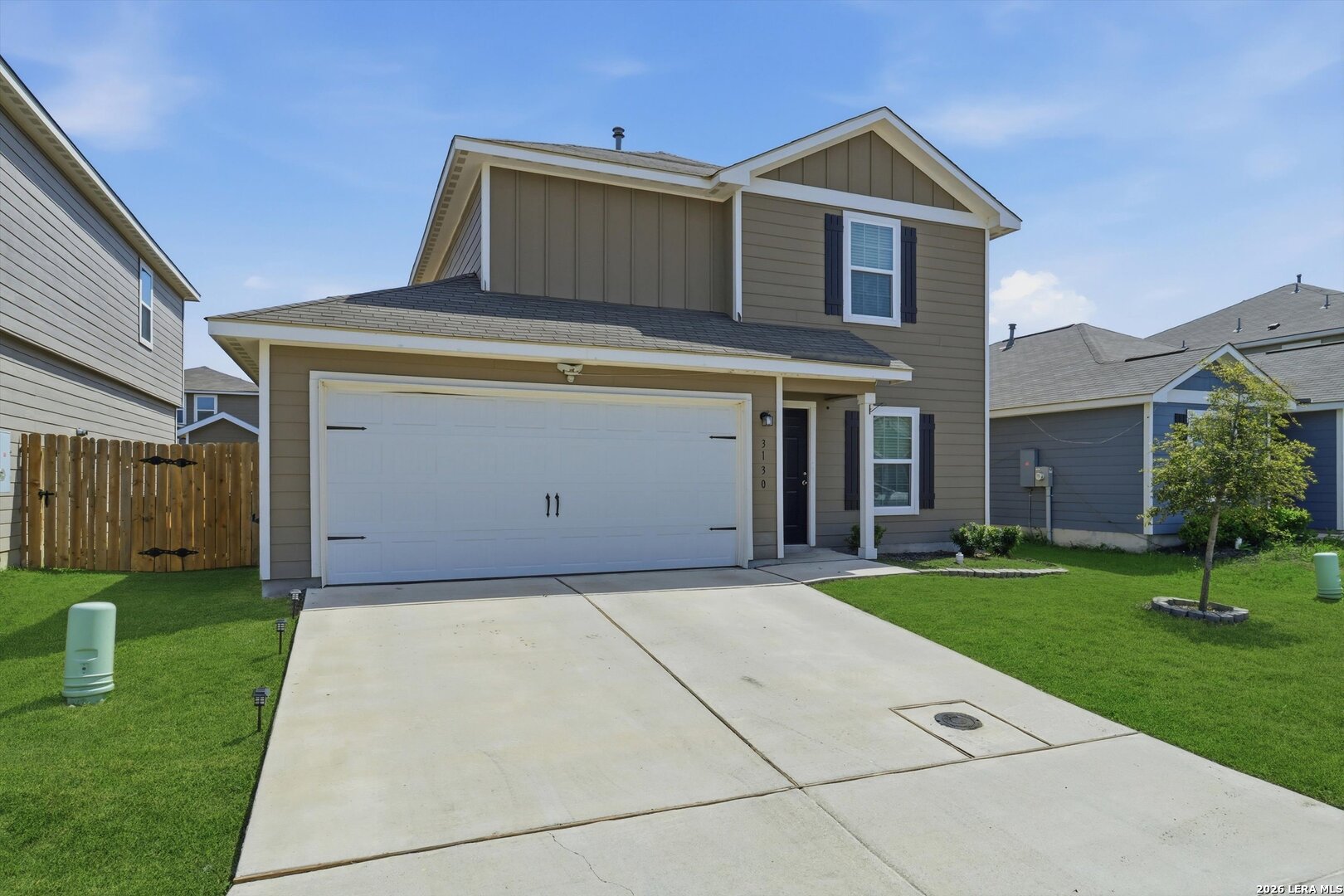 3130 Jackson Converse, TX 78109 - Photo 5 of 22 a front view of a house with a yard and garage