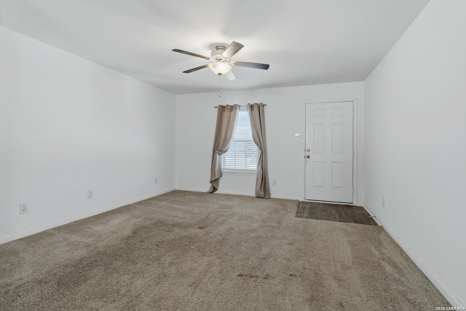 3130 Jackson Converse, TX 78109 - Photo 6 of 22 an empty room with a ceiling fan and window