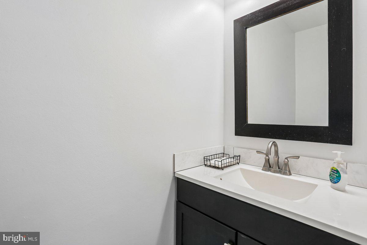 76 Timber Rock Road Gaithersburg, MD 20878 - Photo 19 of 51 a bathroom with a sink and a mirror