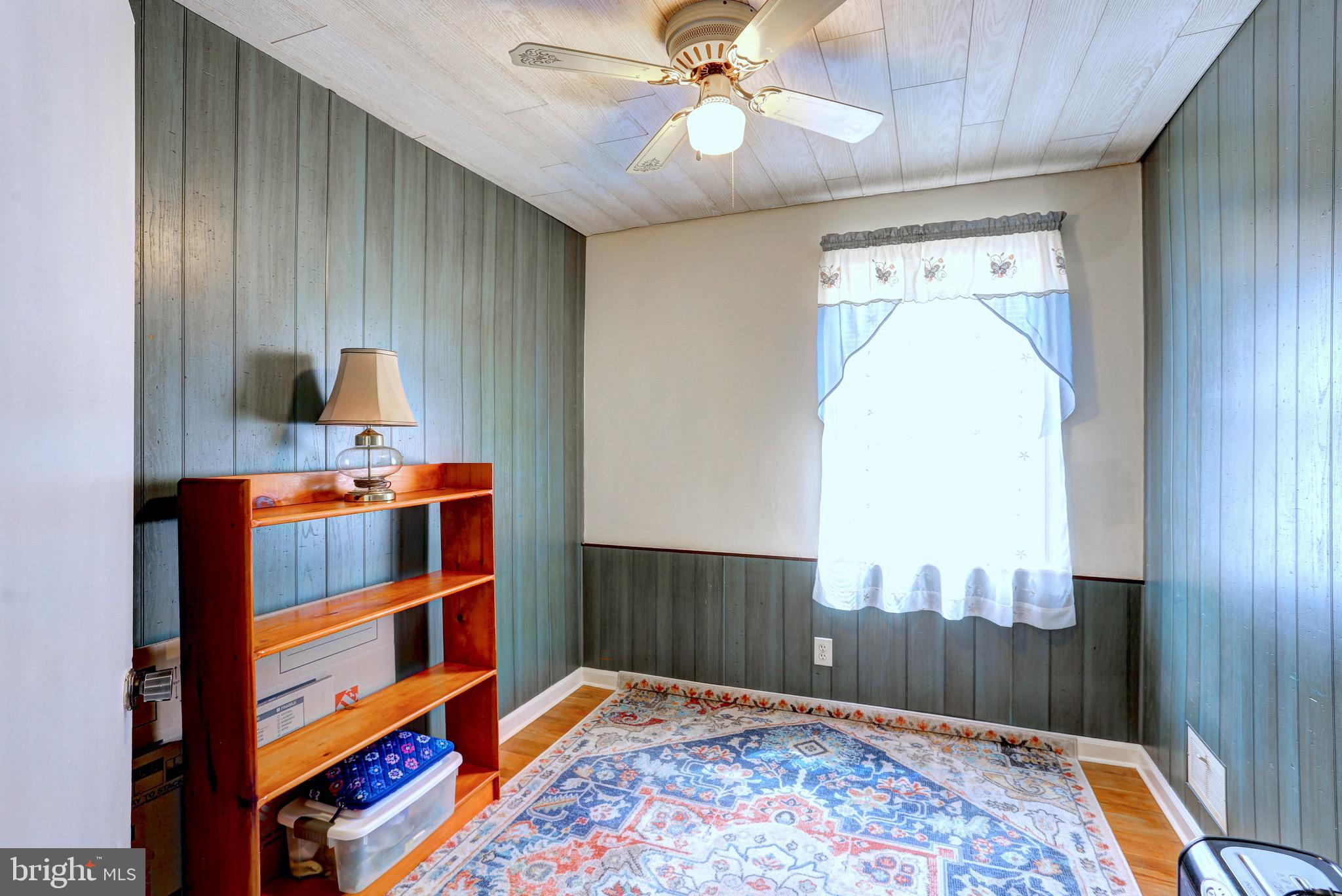 123 Garden Ridge Road Baltimore, MD 21228 - Photo 16 of 29 a bedroom with furniture and a rug