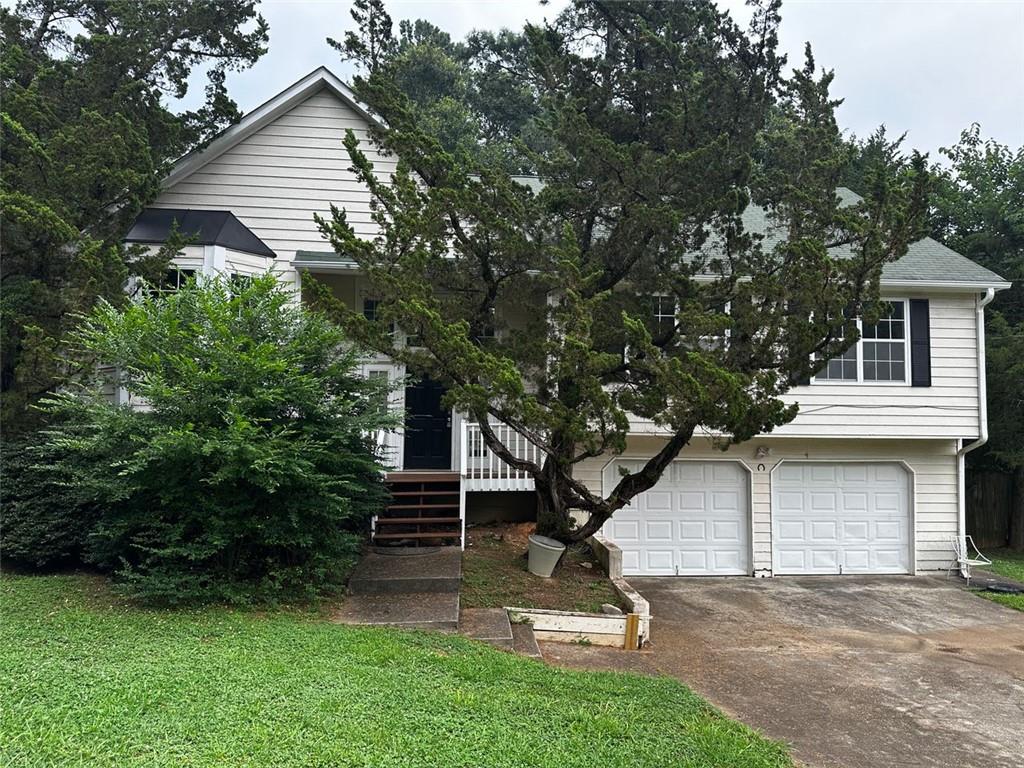 a view of backyard with a garden and entertaining space