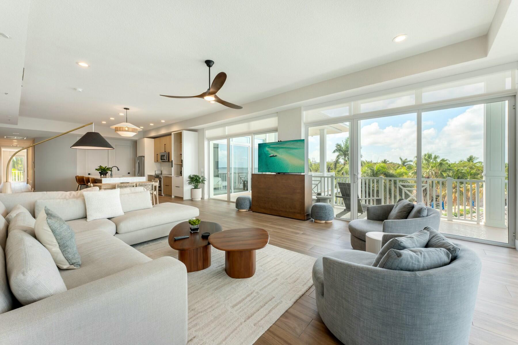 104000 Overseas Highway, Unit 5 Key Largo, FL 33037 - Photo 11 of 60 a living room with furniture and a large window