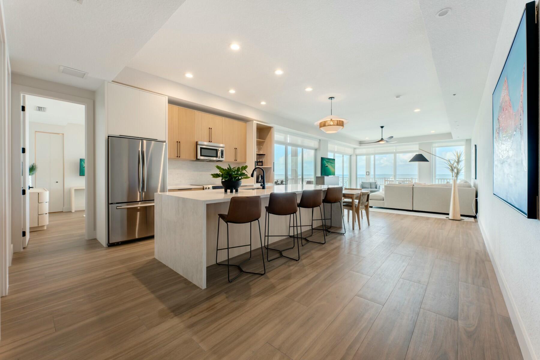 104000 Overseas Highway, Unit 5 Key Largo, FL 33037 - Photo 2 of 60 a kitchen with stainless steel appliances a refrigerator and a stove top oven