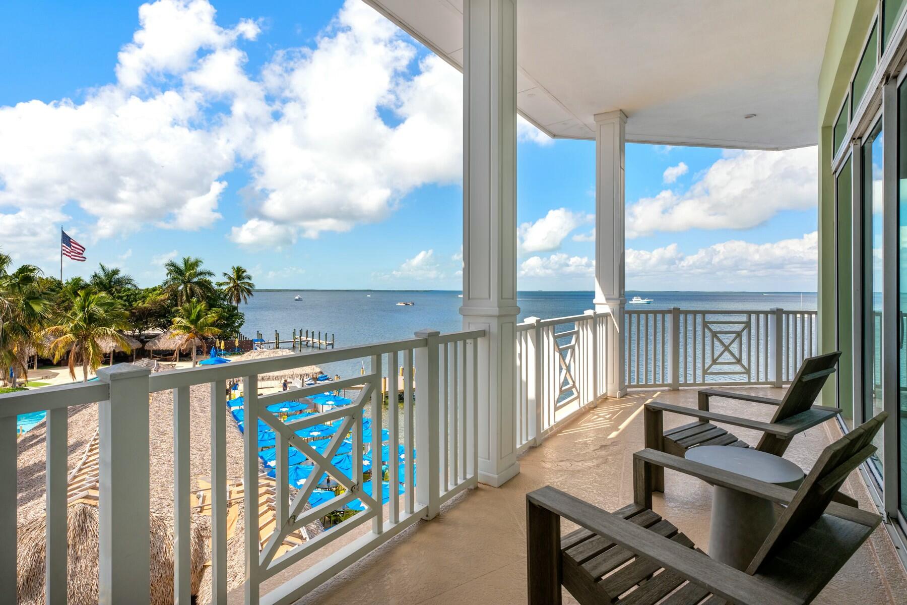 104000 Overseas Highway, Unit 5 Key Largo, FL 33037 - Photo 30 of 60 a view of balcony with wooden floor and outdoor seating