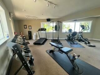 104000 Overseas Highway, Unit 5 Key Largo, FL 33037 - Photo 32 of 60 a room with gym equipment and windows