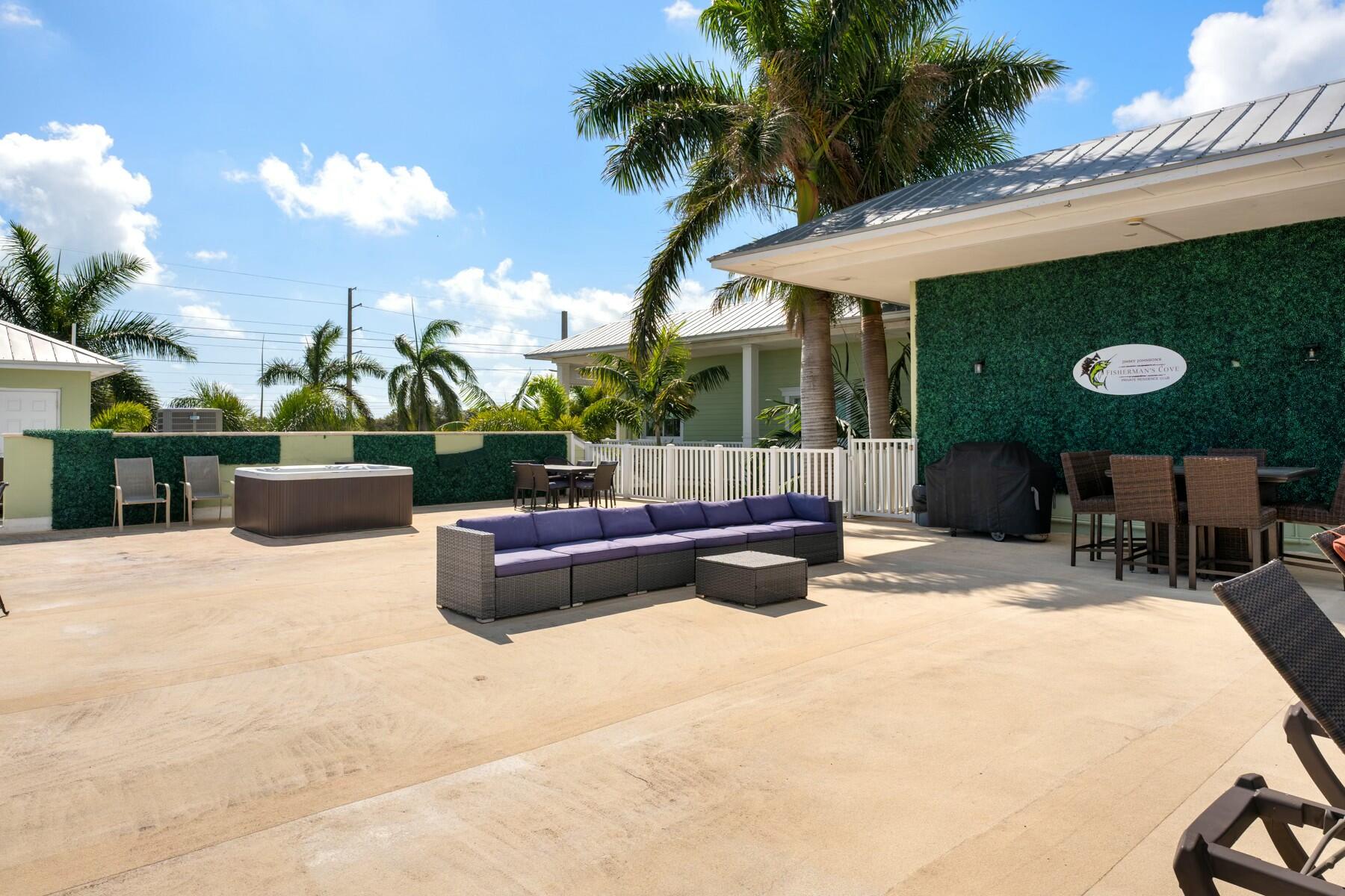 104000 Overseas Highway, Unit 5 Key Largo, FL 33037 - Photo 35 of 60 a view of a backyard with sitting area