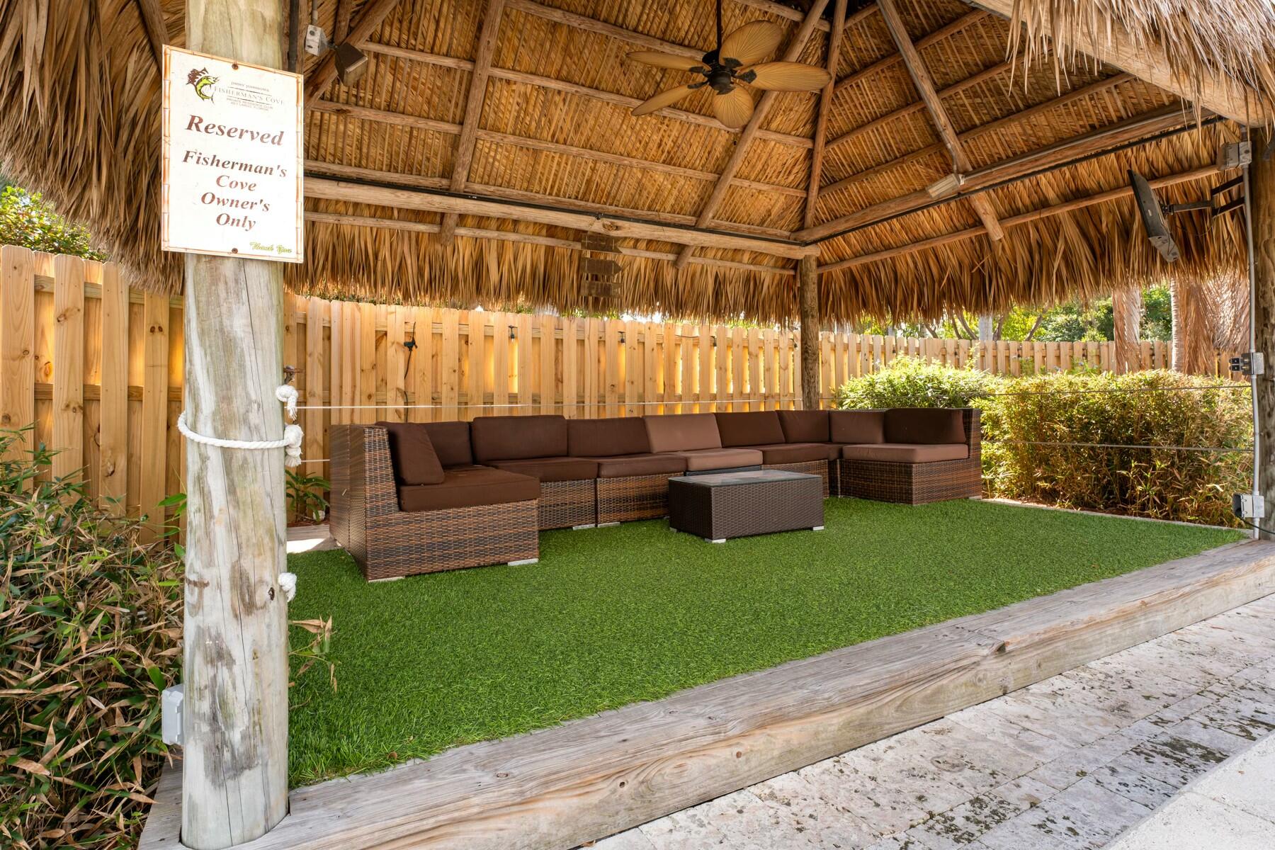 104000 Overseas Highway, Unit 5 Key Largo, FL 33037 - Photo 39 of 60 a view of a backyard with plants and patio