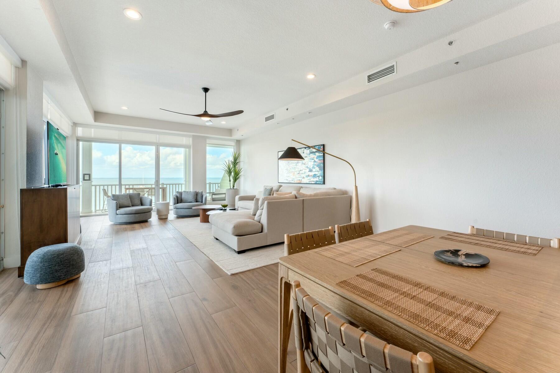 104000 Overseas Highway, Unit 5 Key Largo, FL 33037 - Photo 7 of 60 a living room with furniture and wooden floor