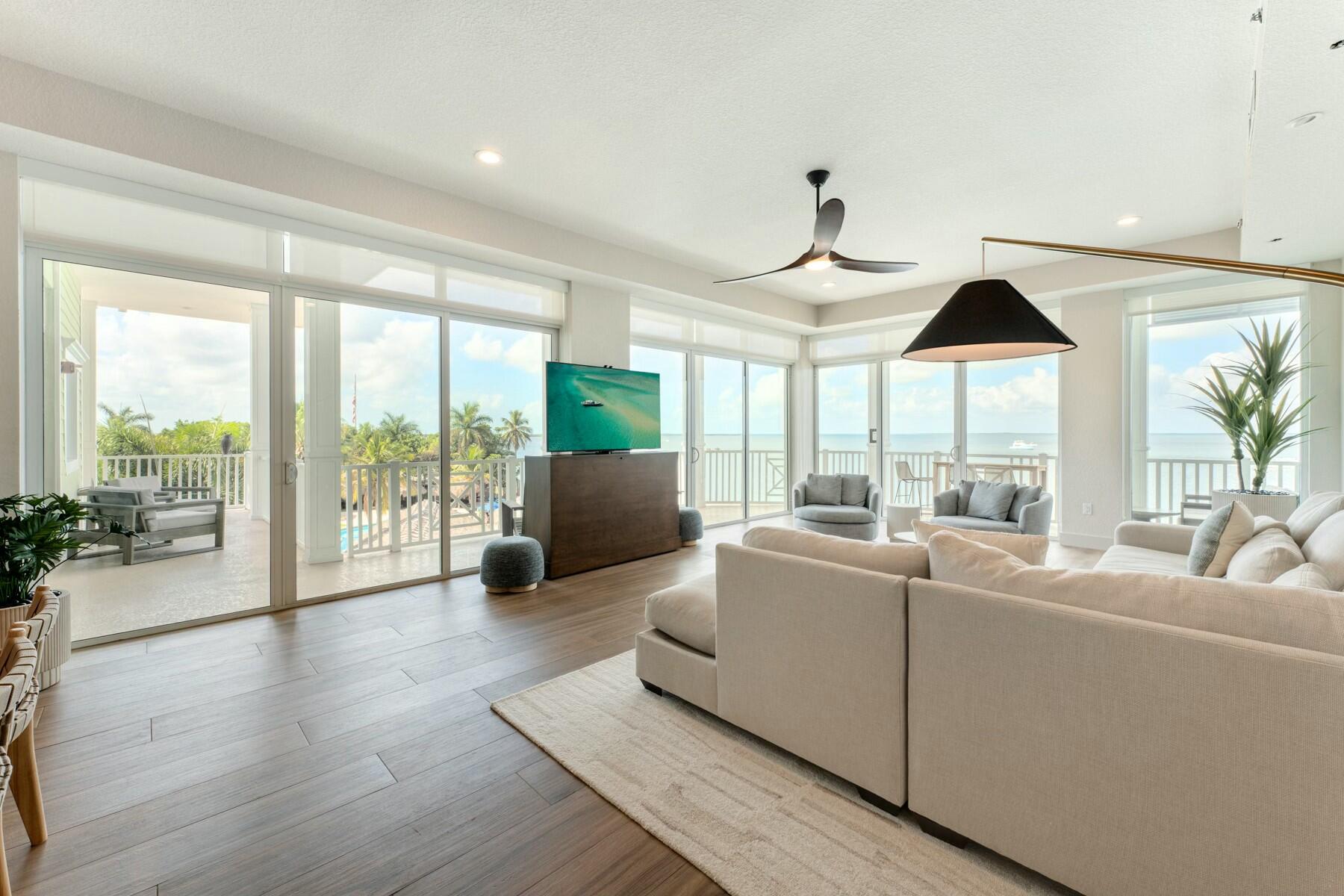 104000 Overseas Highway, Unit 5 Key Largo, FL 33037 - Photo 9 of 60 a living room with furniture and a large window