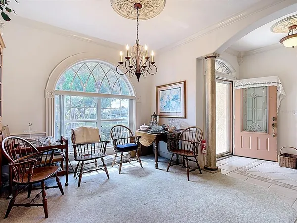 a living room with furniture and a lamp