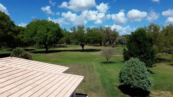 a view of a golf course with a yard