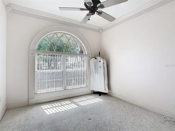 a big room with furniture and a flat screen tv