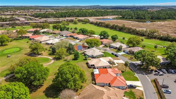 an aerial view of a house with a swimming pool