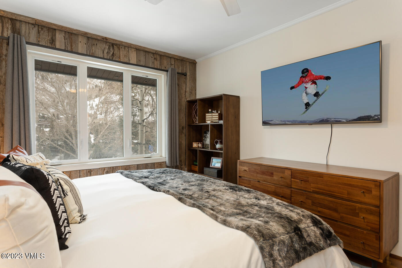 1880 Meadow Ridge Road, Unit 9 Vail, CO 81657 - Photo 14 of 24 a bedroom with a bed and a large window