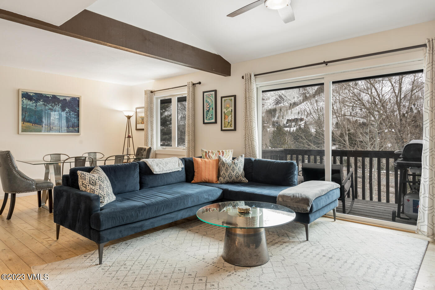 1880 Meadow Ridge Road, Unit 9 Vail, CO 81657 - Photo 2 of 24 a living room with furniture and a large window