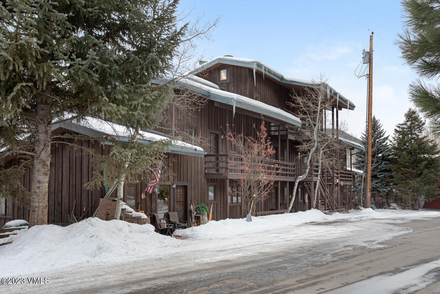 1880 Meadow Ridge Road, Unit 9 Vail, CO 81657 - Photo 24 of 24 a front view of a house with a yard