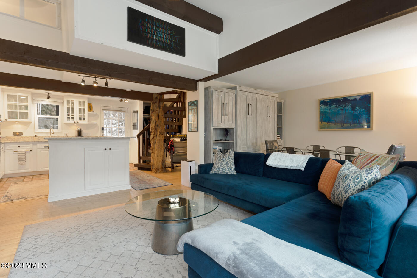 1880 Meadow Ridge Road, Unit 9 Vail, CO 81657 - Photo 4 of 24 a living room with furniture and flat screen tv