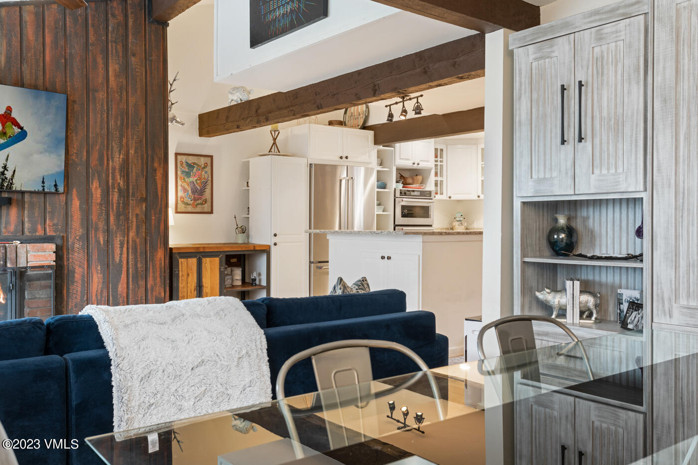 1880 Meadow Ridge Road, Unit 9 Vail, CO 81657 - Photo 8 of 24 a living room with furniture a rug and a window