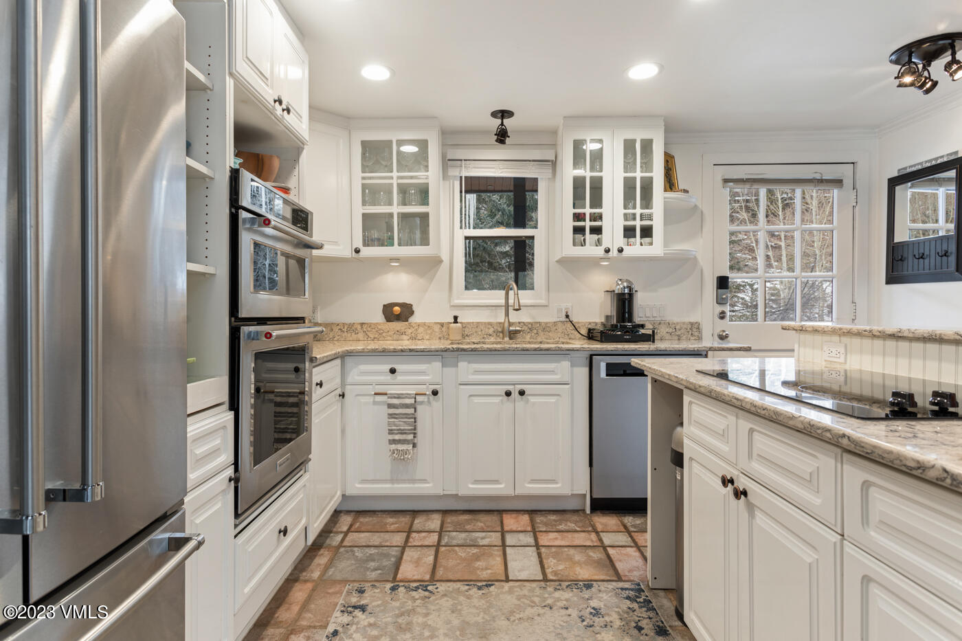 1880 Meadow Ridge Road, Unit 9 Vail, CO 81657 - Photo 10 of 24 a kitchen with a sink stove and refrigerator