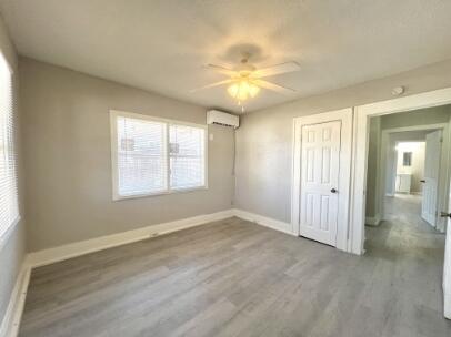 2315 15th Street Lubbock, TX 79401 - Photo 8 of 10 wooden floor in an empty room with a window