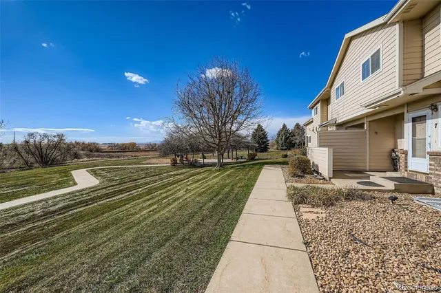 a view of a backyard of the house