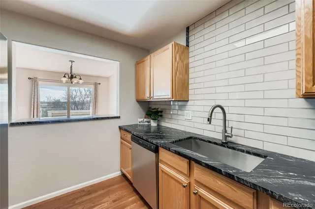 a kitchen with a sink and cabinets