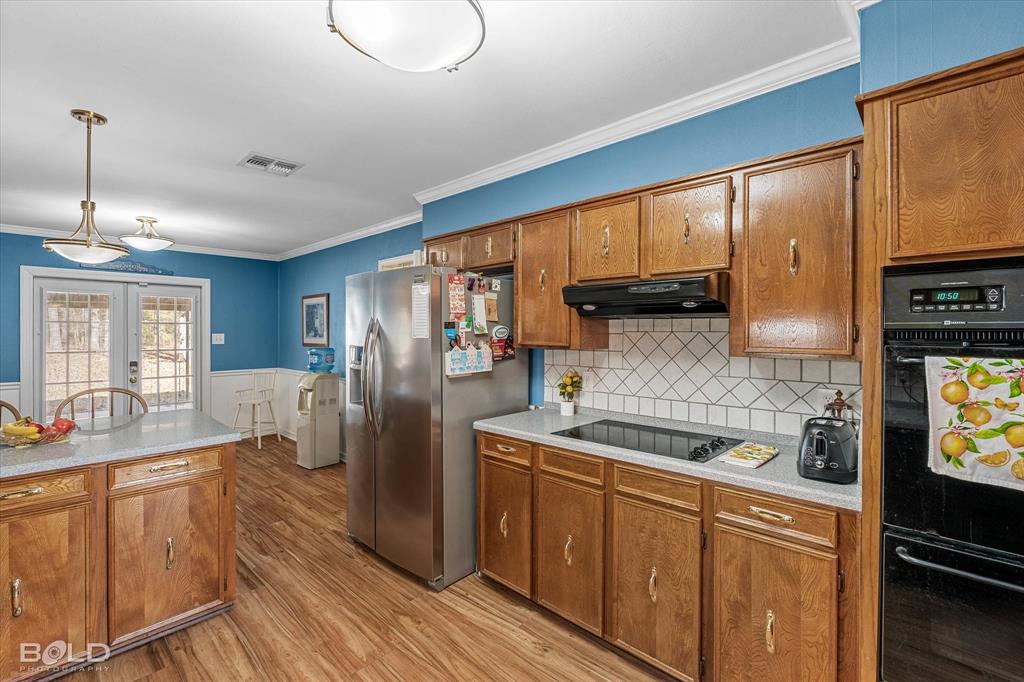 8543 Sac Fox Road Shreveport, LA 71107 - Photo 17 of 35 a kitchen with stainless steel appliances granite countertop a sink stove and refrigerator