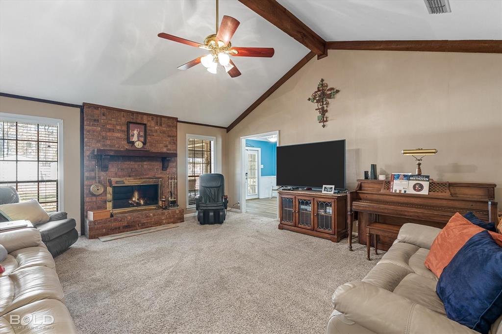 8543 Sac Fox Road Shreveport, LA 71107 - Photo 25 of 35 a living room with furniture and a flat screen tv