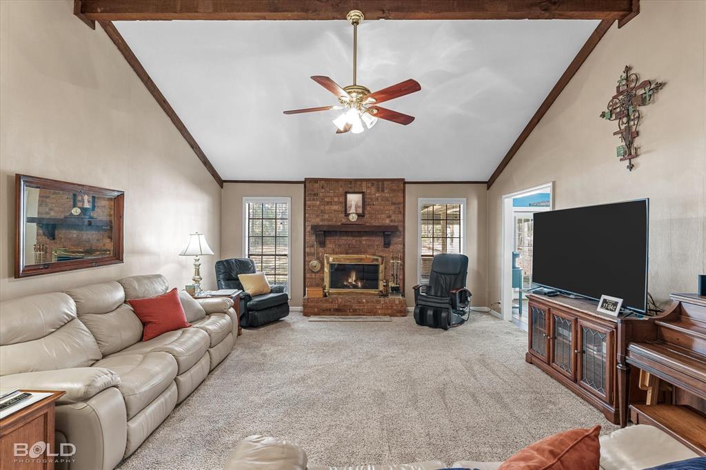 8543 Sac Fox Road Shreveport, LA 71107 - Photo 26 of 35 a living room with furniture and a flat screen tv