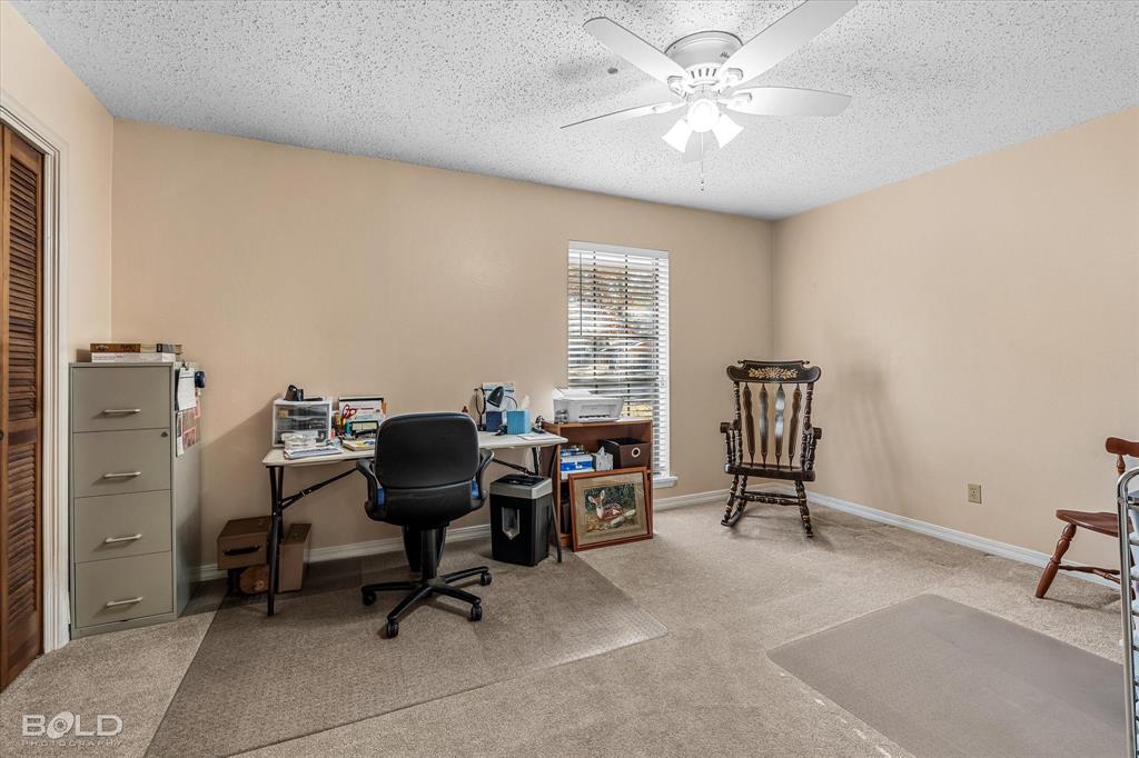 8543 Sac Fox Road Shreveport, LA 71107 - Photo 30 of 35 a view of a workspace with furniture and a window