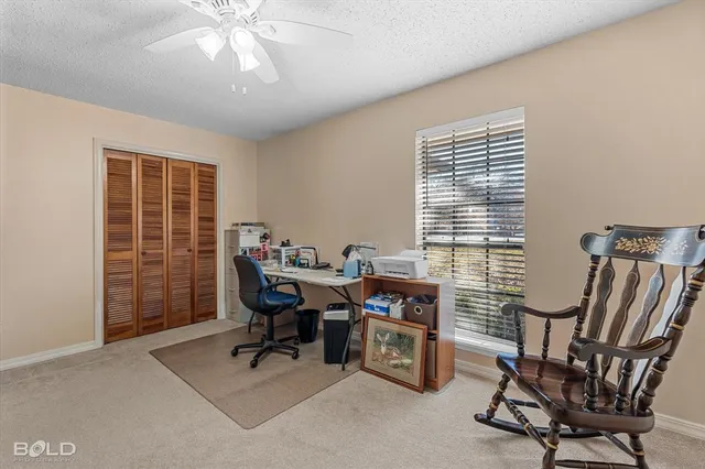 a bedroom with furniture and a chandelier