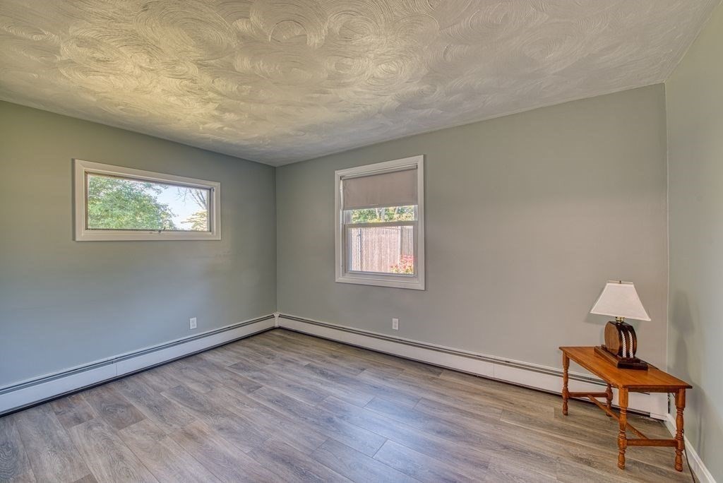 81 Errol Road Brockton, MA 02302 - Photo 13 of 31 wooden floor in an empty room with a window