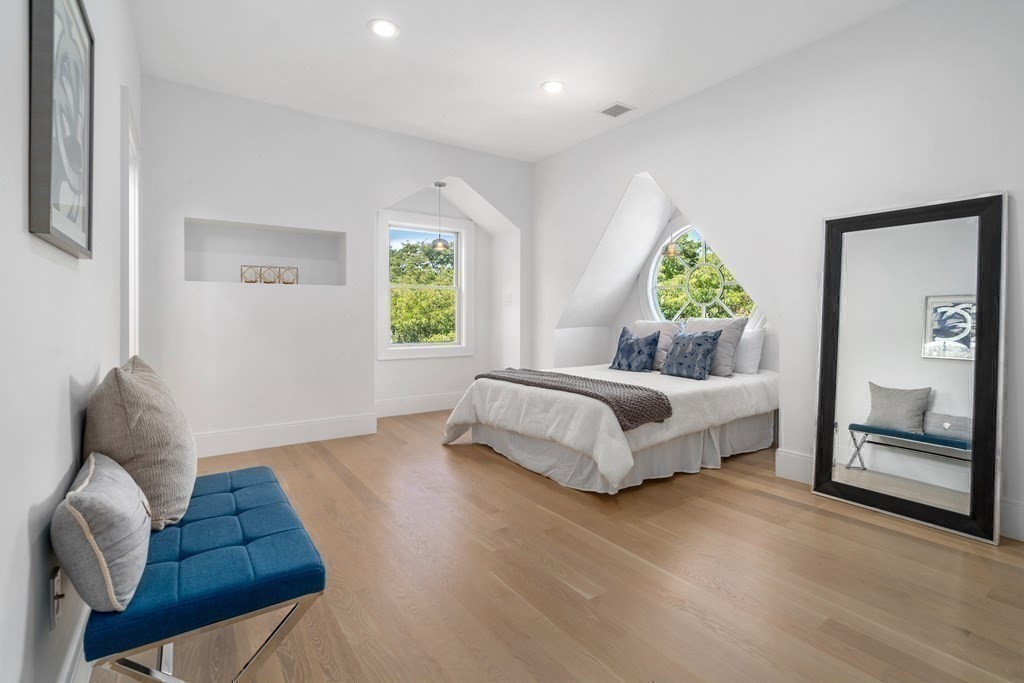 89 University Road Brookline, MA 02445 - Photo 22 of 41 a spacious bedroom with a bed and window