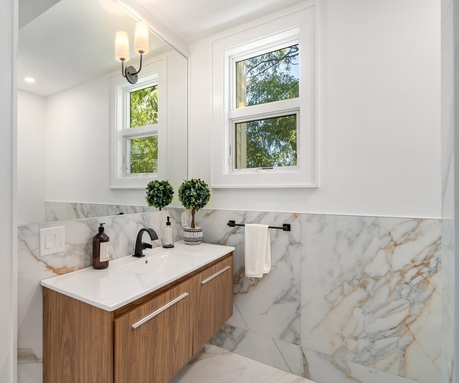 89 University Road Brookline, MA 02445 - Photo 26 of 41 a bathroom with a sink and a window