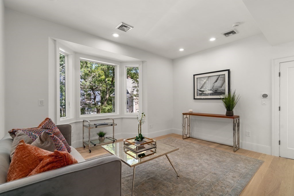 89 University Road Brookline, MA 02445 - Photo 28 of 41 a living room with furniture and a window