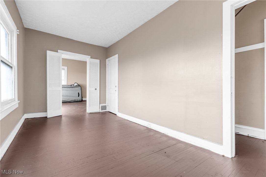 3770 Mayfield Road Cleveland Heights, OH 44121 - Photo 12 of 22 Corridor with a healthy amount of sunlight and dark wood-type flooring