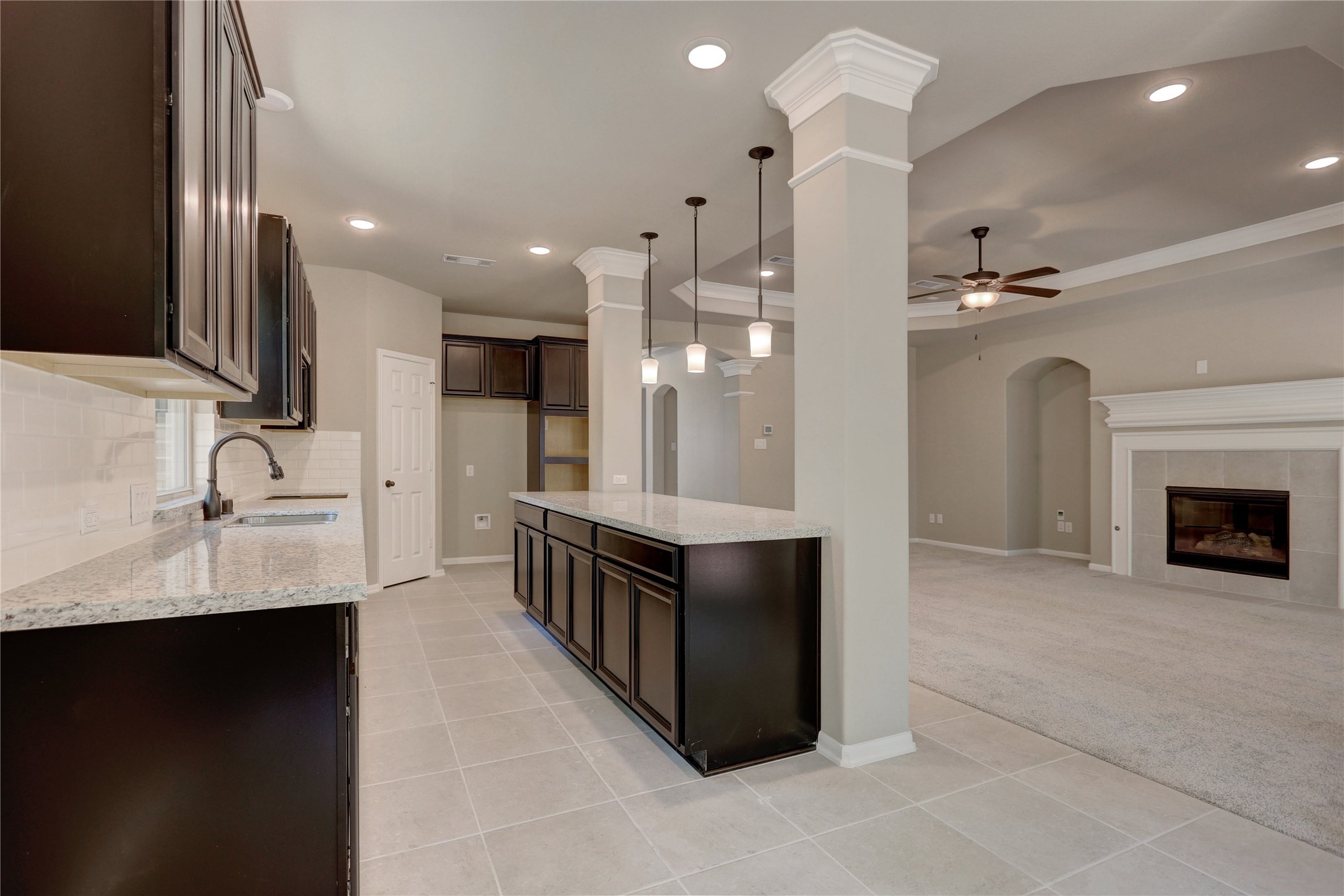 403 Black Walnut Drive Conroe, TX 77304 - Photo 3 of 15 a large kitchen with stainless steel appliances granite countertop a sink and a refrigerator